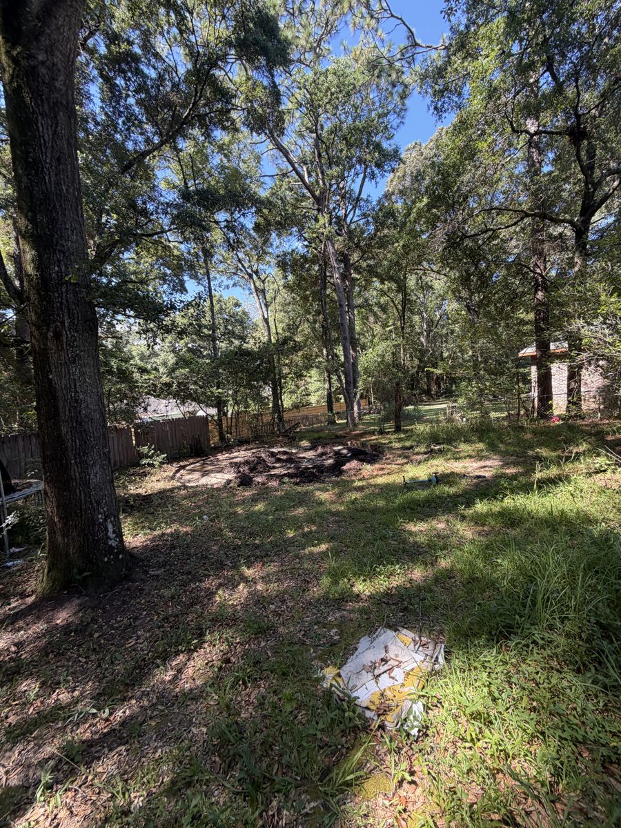 Backyard cleared after above-ground pool removal in Mobile, AL